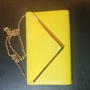 Aldo Yellow Clutch some spots.  Has a snap closure and chain shoulder strap